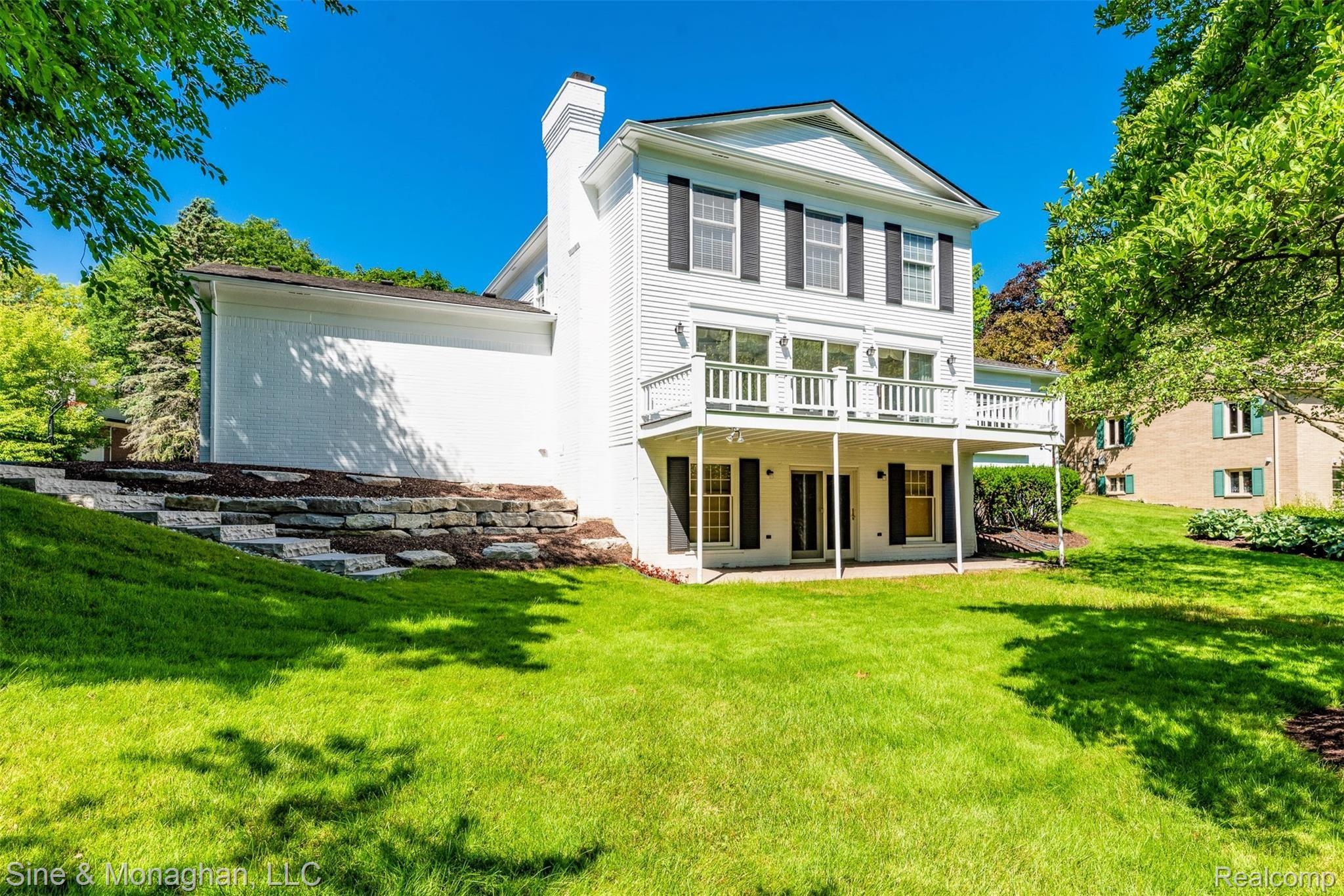 Rear view with stone walkway.