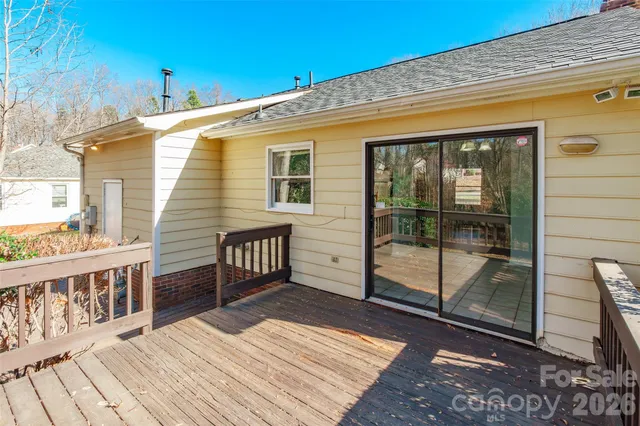 a view of a house with wooden deck