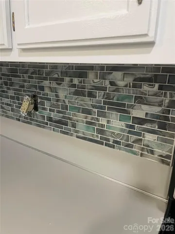 a close view of sink and cabinets