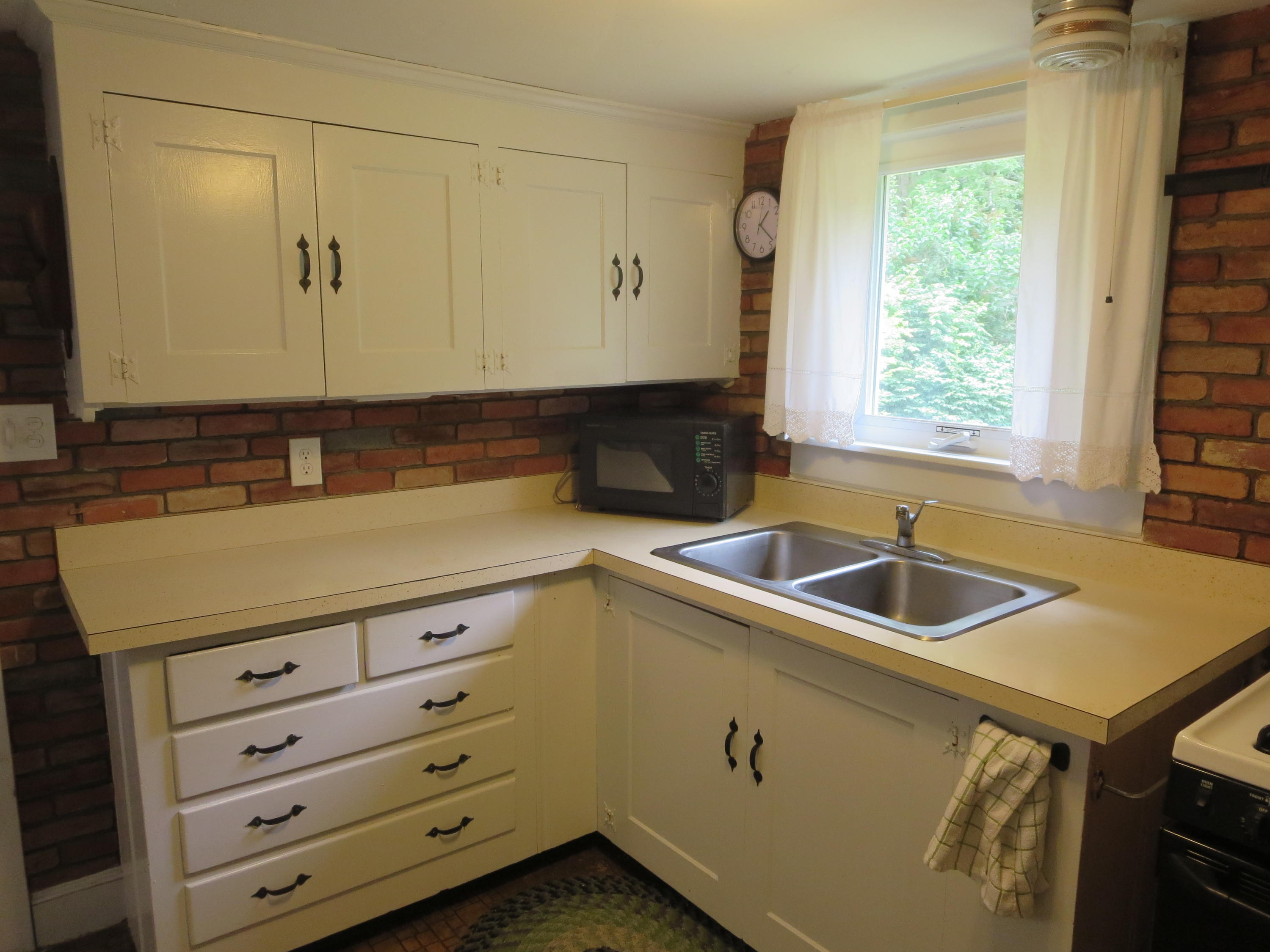 29 Kelley Road Hyannis, MA 02601 - Photo 13 of 21 a kitchen with granite countertop cabinets sink and window