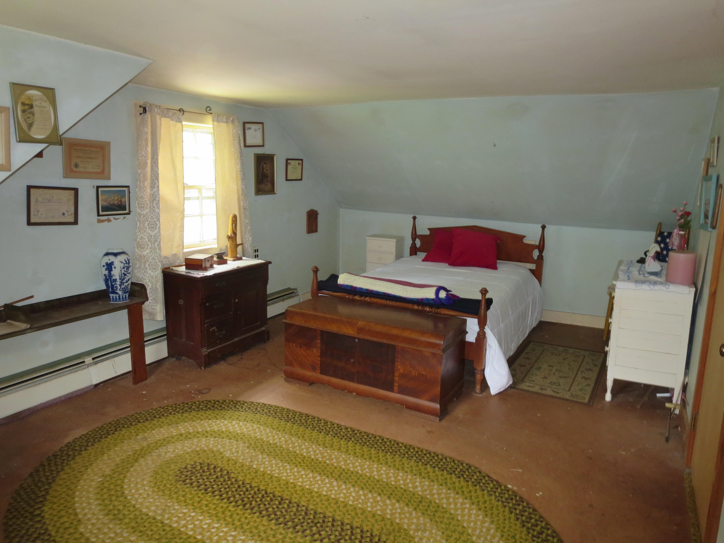 29 Kelley Road Hyannis, MA 02601 - Photo 18 of 21 a bedroom with a bed and wooden floor