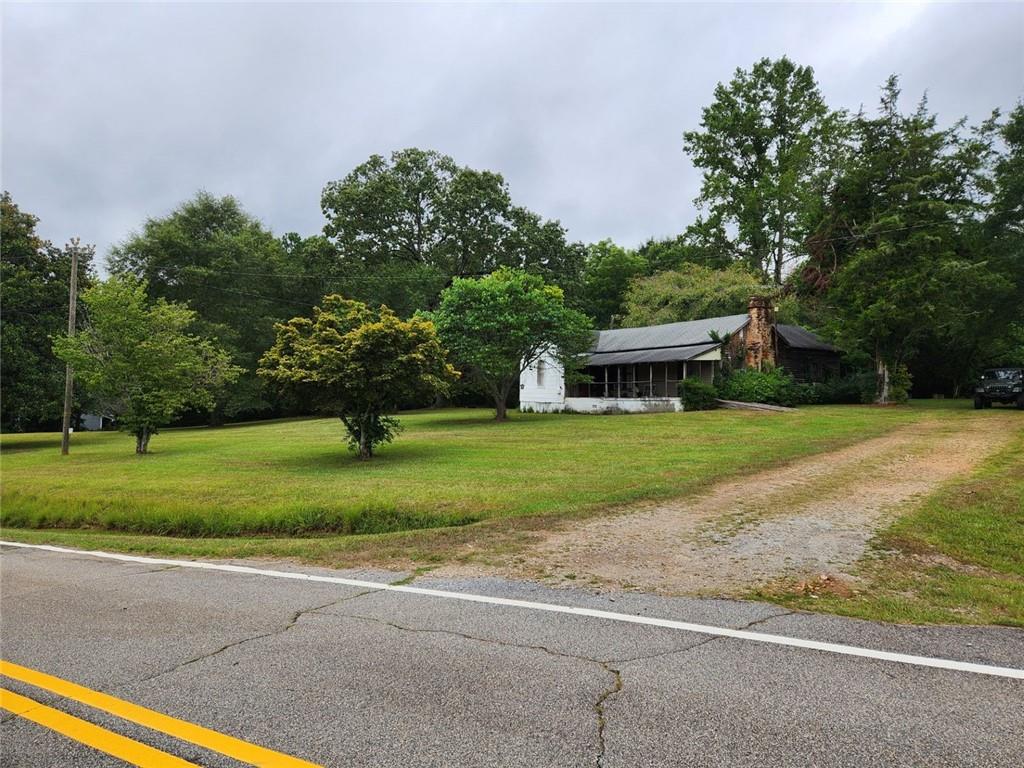 1177 Davis Road Carrollton, GA 30116 - Photo 1 of 1 a house view with a garden space