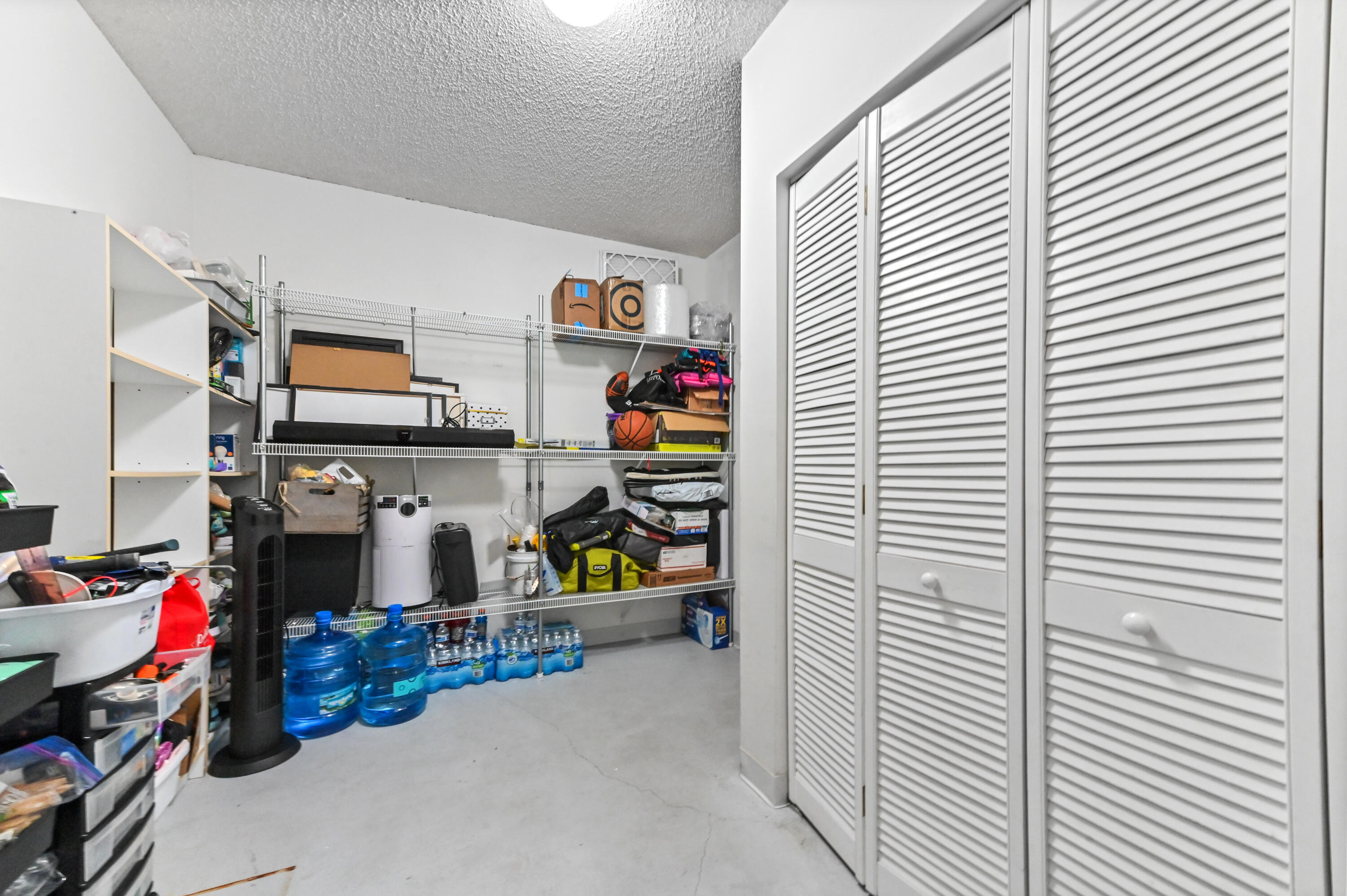 7433 Shell Ridge Terrace Lake Worth, FL 33467 - Photo 25 of 45 a room with storage and utility