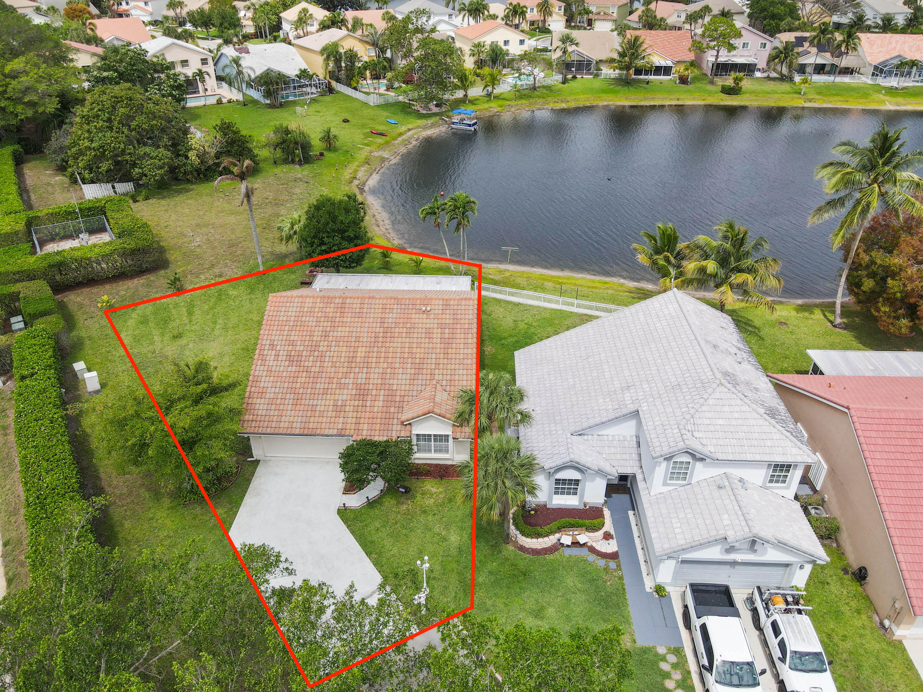 7433 Shell Ridge Terrace Lake Worth, FL 33467 - Photo 3 of 45 an aerial view of a house with a lake view