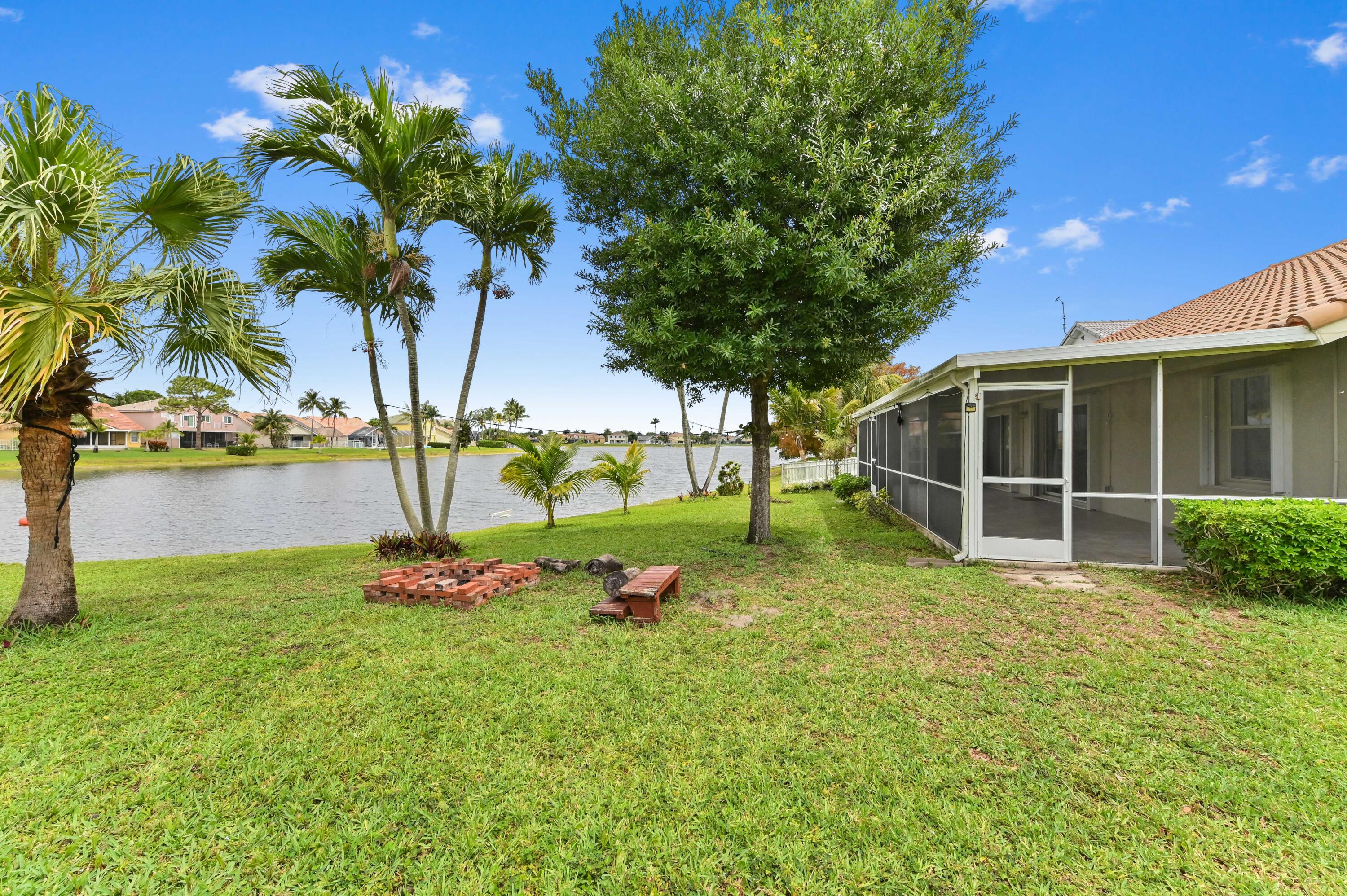 7433 Shell Ridge Terrace Lake Worth, FL 33467 - Photo 32 of 45 a view of a backyard with a garden