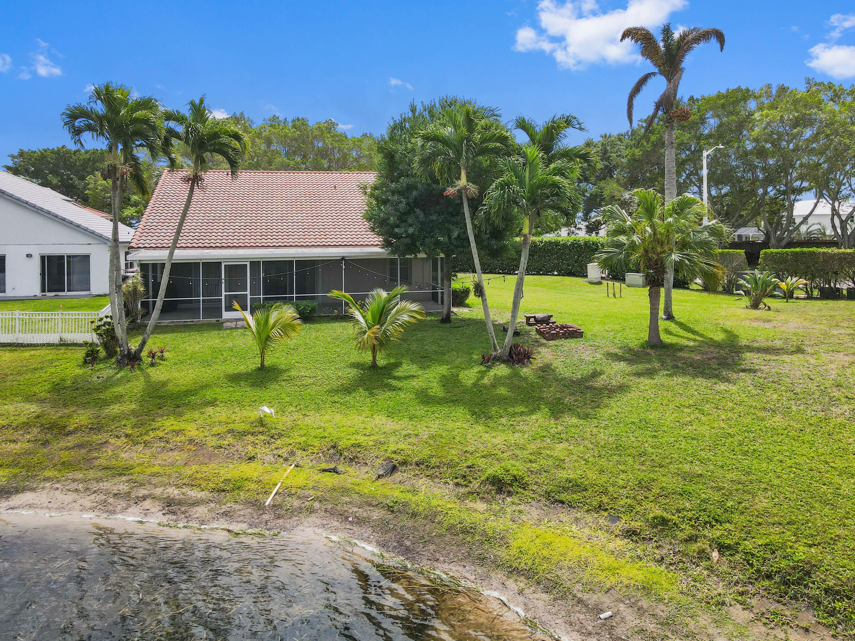 7433 Shell Ridge Terrace Lake Worth, FL 33467 - Photo 40 of 45 a view of a house with a backyard