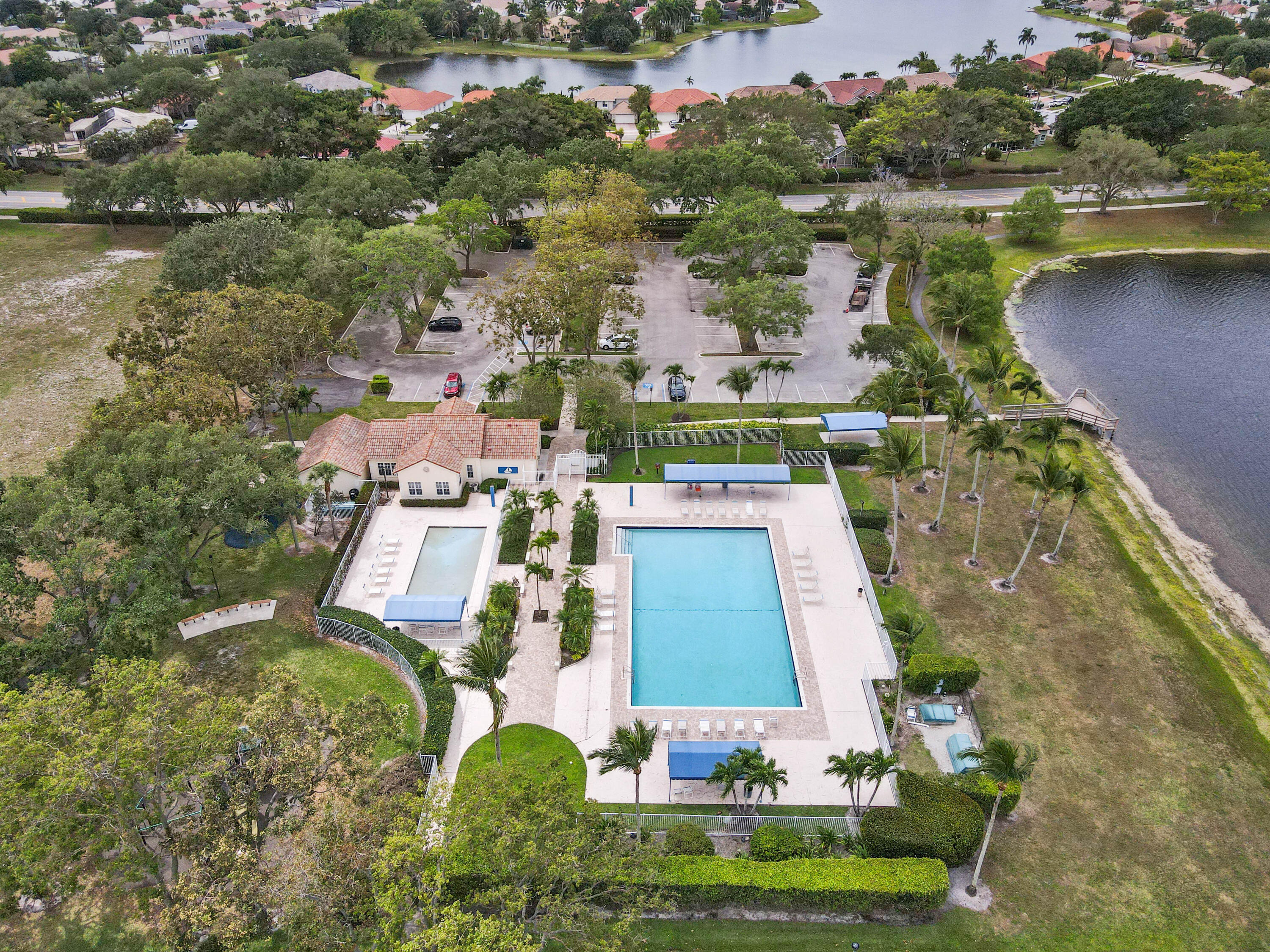 7433 Shell Ridge Terrace Lake Worth, FL 33467 - Photo 44 of 45 an aerial view of residential houses with outdoor space and lake view