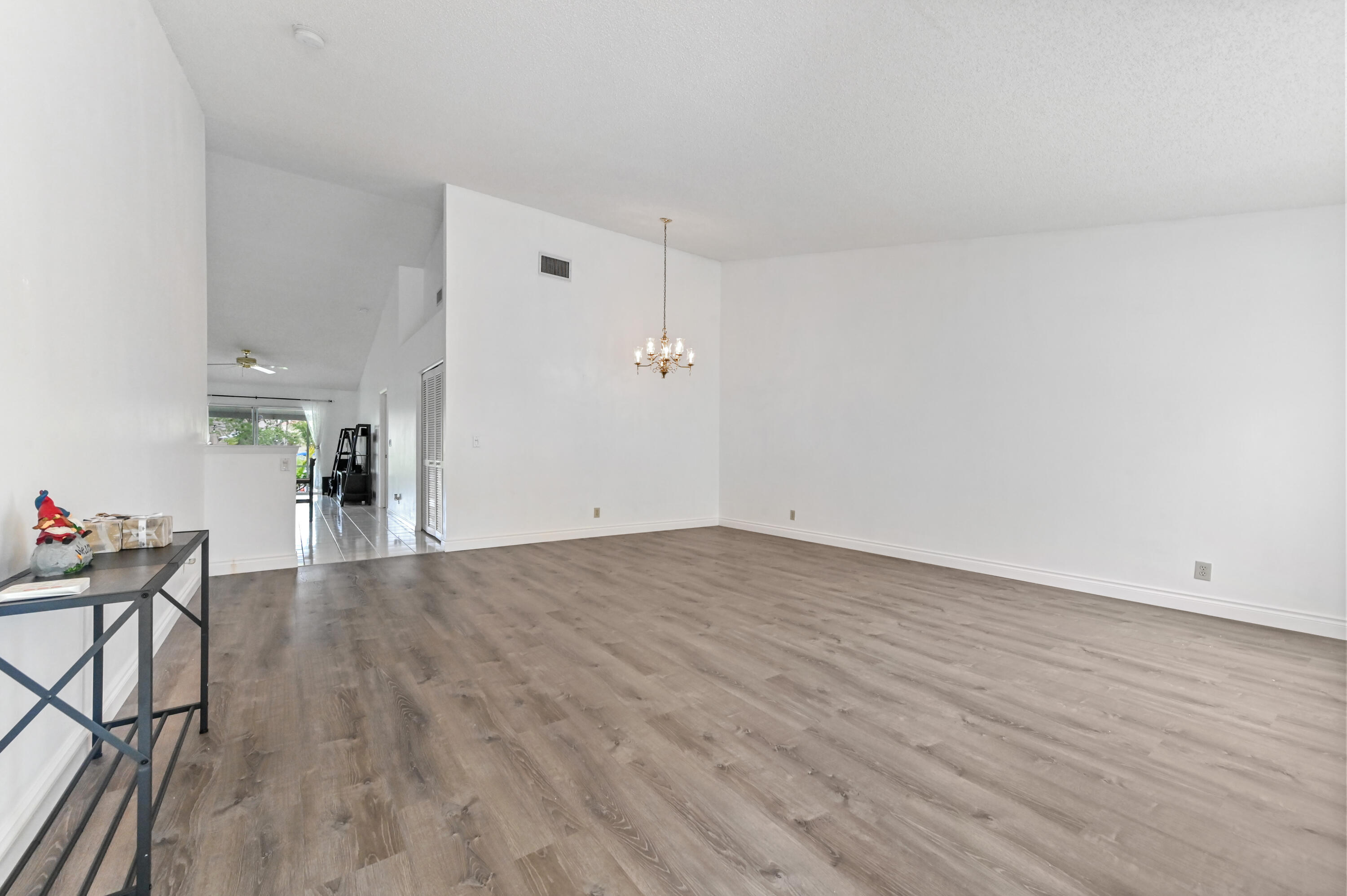 7433 Shell Ridge Terrace Lake Worth, FL 33467 - Photo 6 of 45 a view of empty room with wooden floor