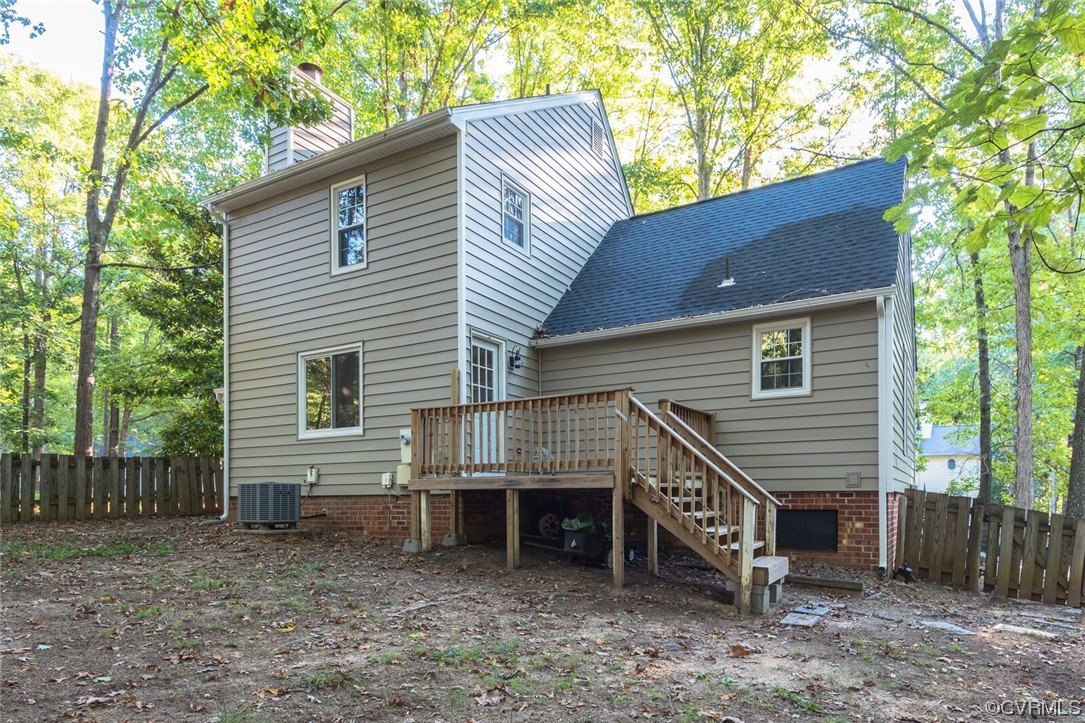 5820 Mill Spring Road Midlothian, VA 23112 - Photo 5 of 35 a view of a house with a yard and wooden deck
