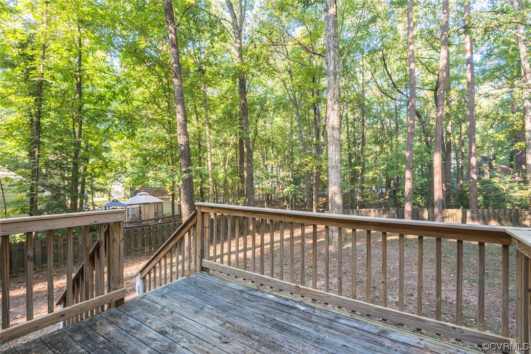 5820 Mill Spring Road Midlothian, VA 23112 - Photo 9 of 35 a view of balcony with wooden floor and fence