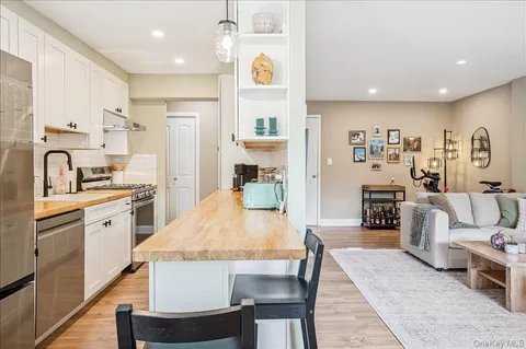 a large kitchen with a table and chairs in it