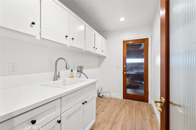 a kitchen with a sink and cabinets