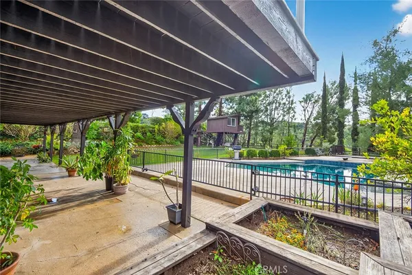 a view of a roof deck with a barbeque grill