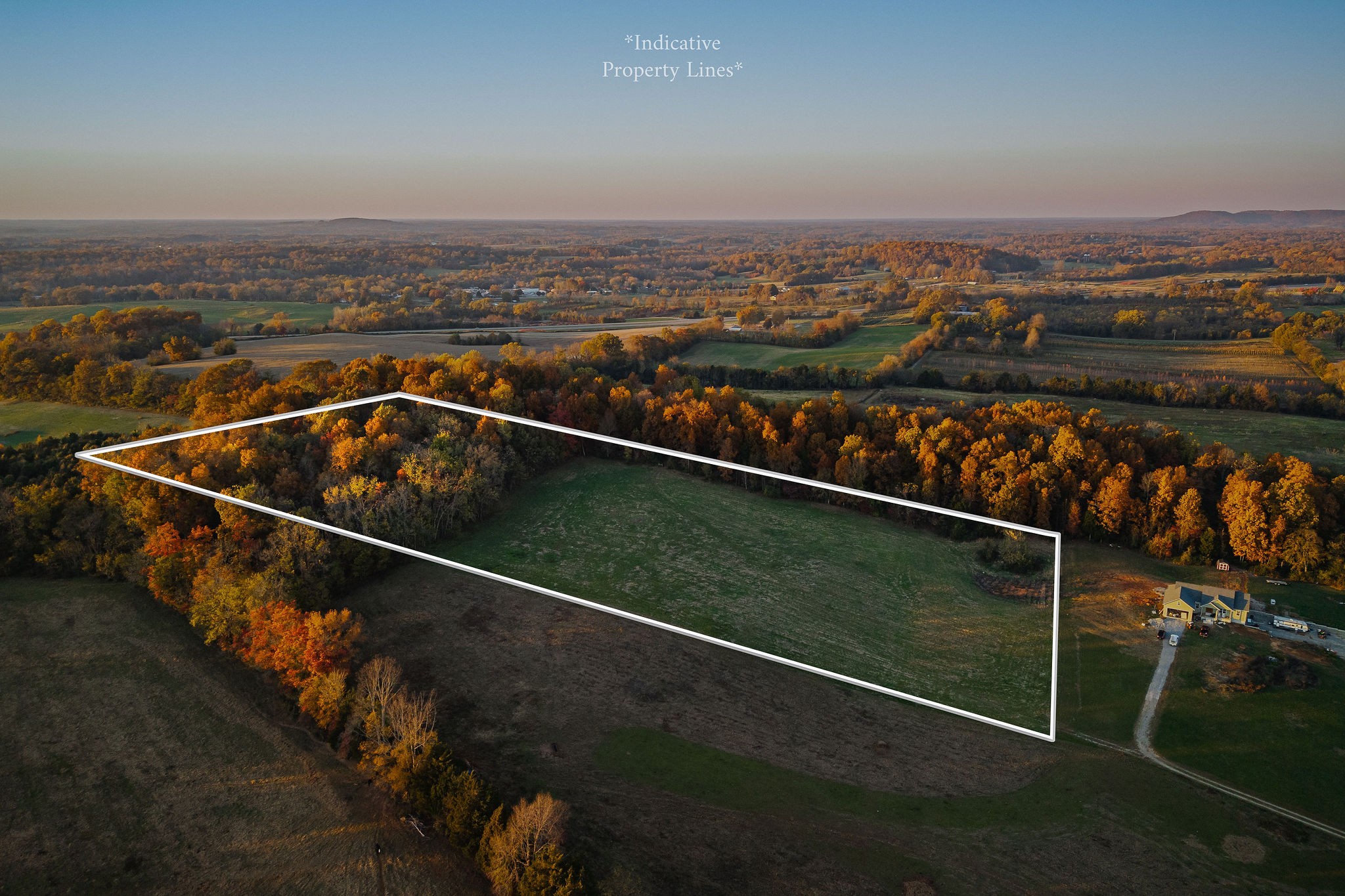 an outdoor space with wooden floor and city view