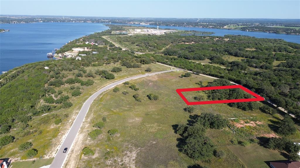 4312 Chicken Gristle Road Granbury, TX 76048 - Photo 2 of 7 a view of a lake with a mountain