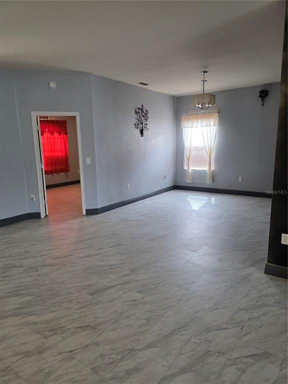 2850 Sheldon Street Lakeland, FL 33813 - Photo 11 of 59 an empty room with windows and fireplace