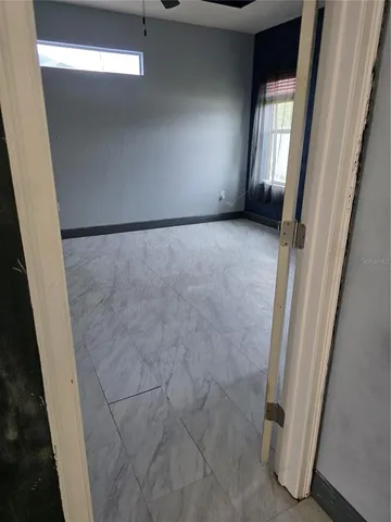 a view of an empty room and window