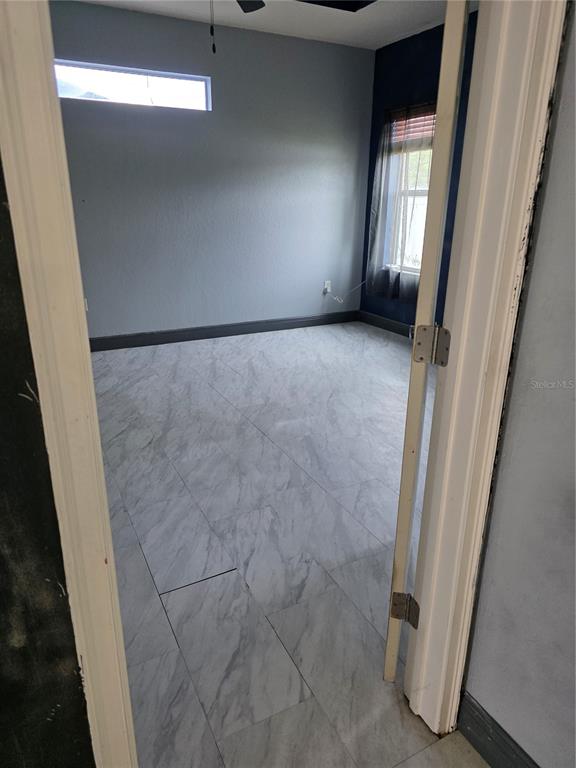 2850 Sheldon Street Lakeland, FL 33813 - Photo 17 of 59 a view of an empty room with a fireplace