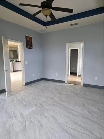 a view of a room with closet and large window