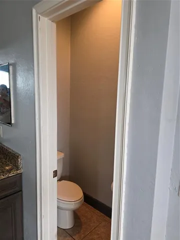 a bathroom with bathtub next to a window