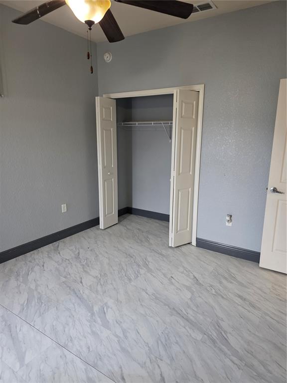 2850 Sheldon Street Lakeland, FL 33813 - Photo 32 of 59 a view of an empty room with a ceiling fan
