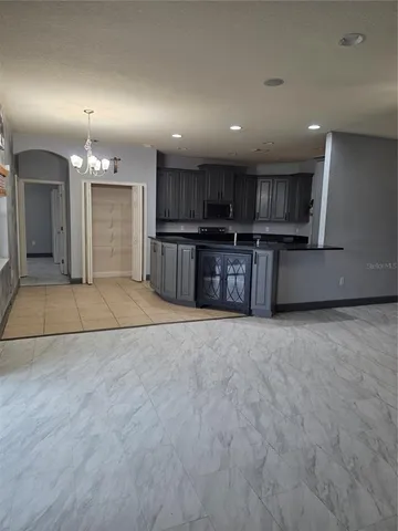 a view of a hallway with wooden shelves