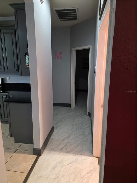 2850 Sheldon Street Lakeland, FL 33813 - Photo 39 of 59 a view of a hallway with wooden shelves