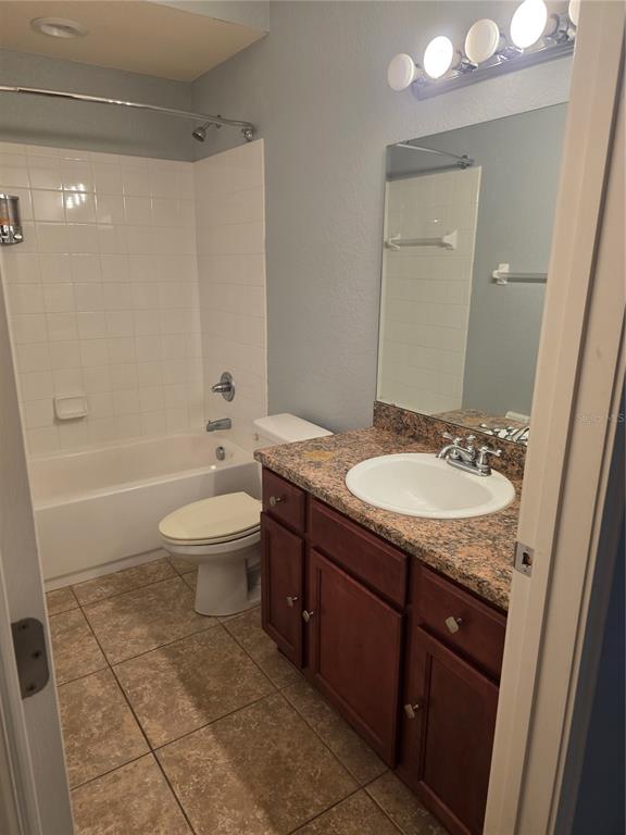 2850 Sheldon Street Lakeland, FL 33813 - Photo 41 of 59 a bathroom with a granite countertop sink toilet and shower