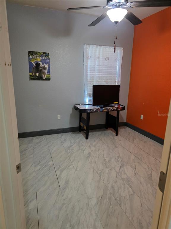 2850 Sheldon Street Lakeland, FL 33813 - Photo 44 of 59 a living room with furniture and a flat screen tv