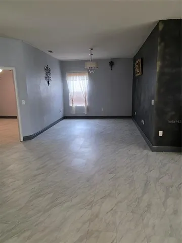 a view of a swimming pool with a yard