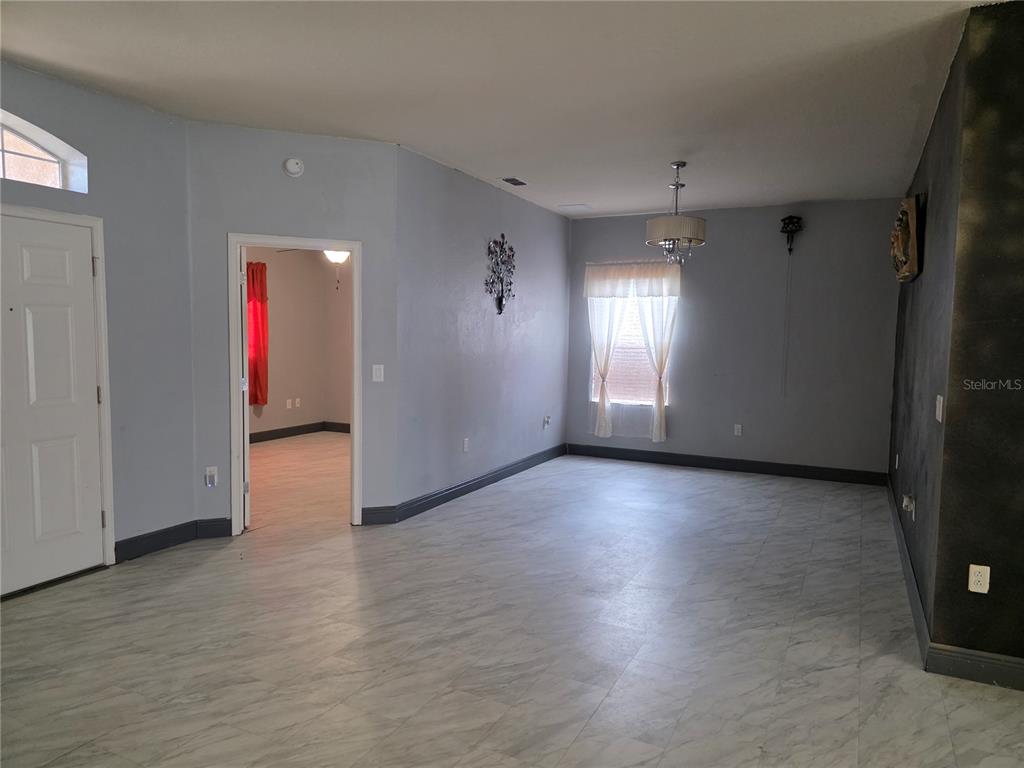 2850 Sheldon Street Lakeland, FL 33813 - Photo 49 of 59 an empty room with wooden floor and windows