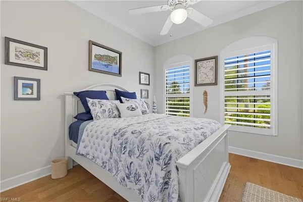 a bedroom with bed and a window