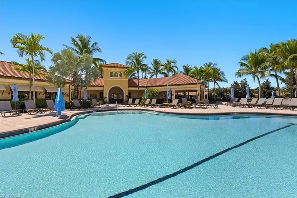 an aerial view of a house with swimming pool garden and patio