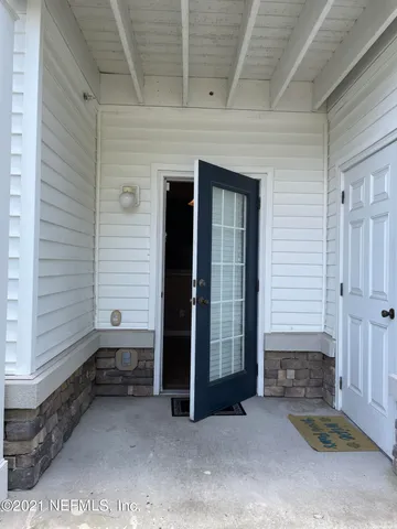 a view of house with backyard