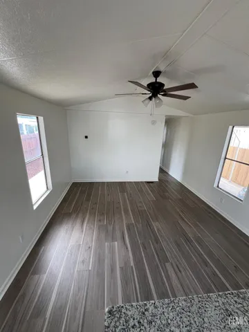 a kitchen with stainless steel appliances a microwave a sink and a stove