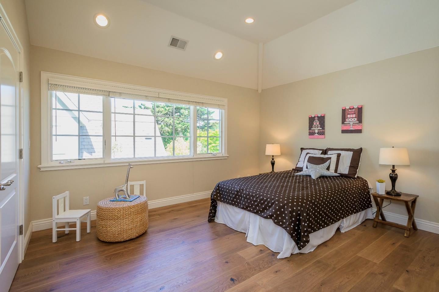 836 Newhall Road Burlingame, CA 94010 - Photo 29 of 38 a bedroom with a bed and wooden floor