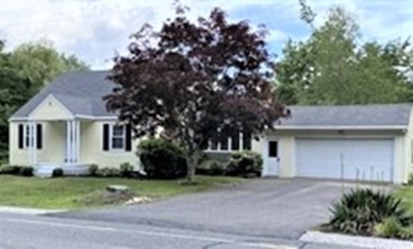 a house view with a backyard space
