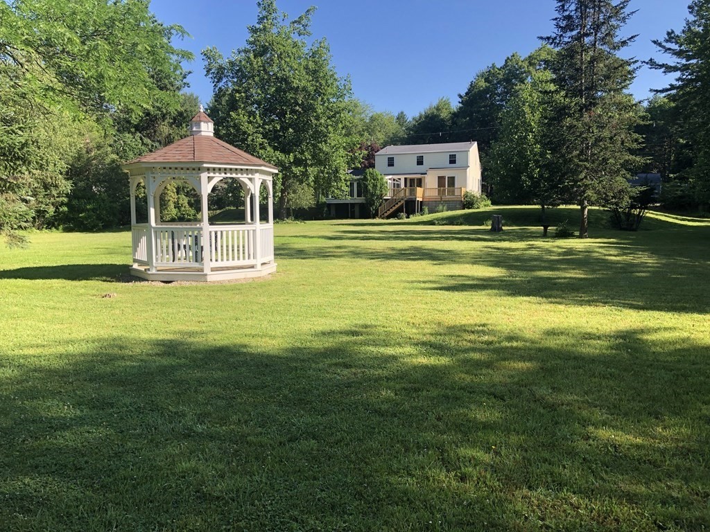 198 Cedar Street Hanover, MA 02339 - Photo 11 of 12 a front view of a house with swimming pool having outdoor seating