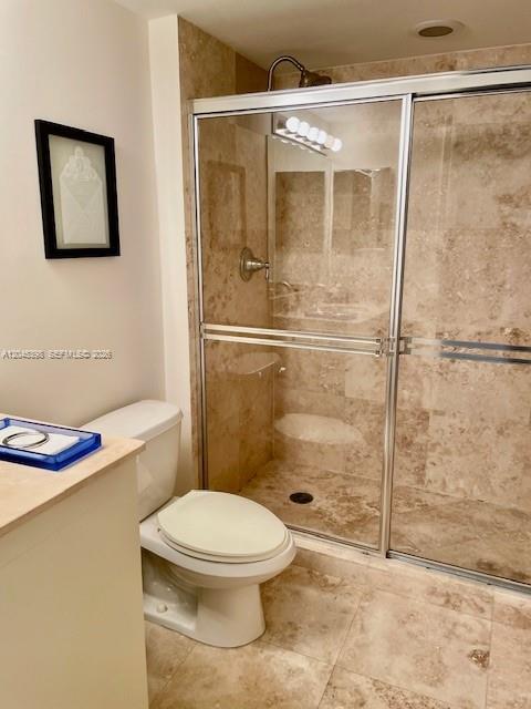 3232 Southwest 22nd Terrace, Unit 1303 Miami, FL 33145 - Photo 25 of 43 a bathroom with a toilet and a shower