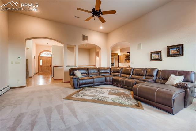 6155 Wilson Road Colorado Springs, CO 80919 - Photo 6 of 35 Great room looking toward entryway.