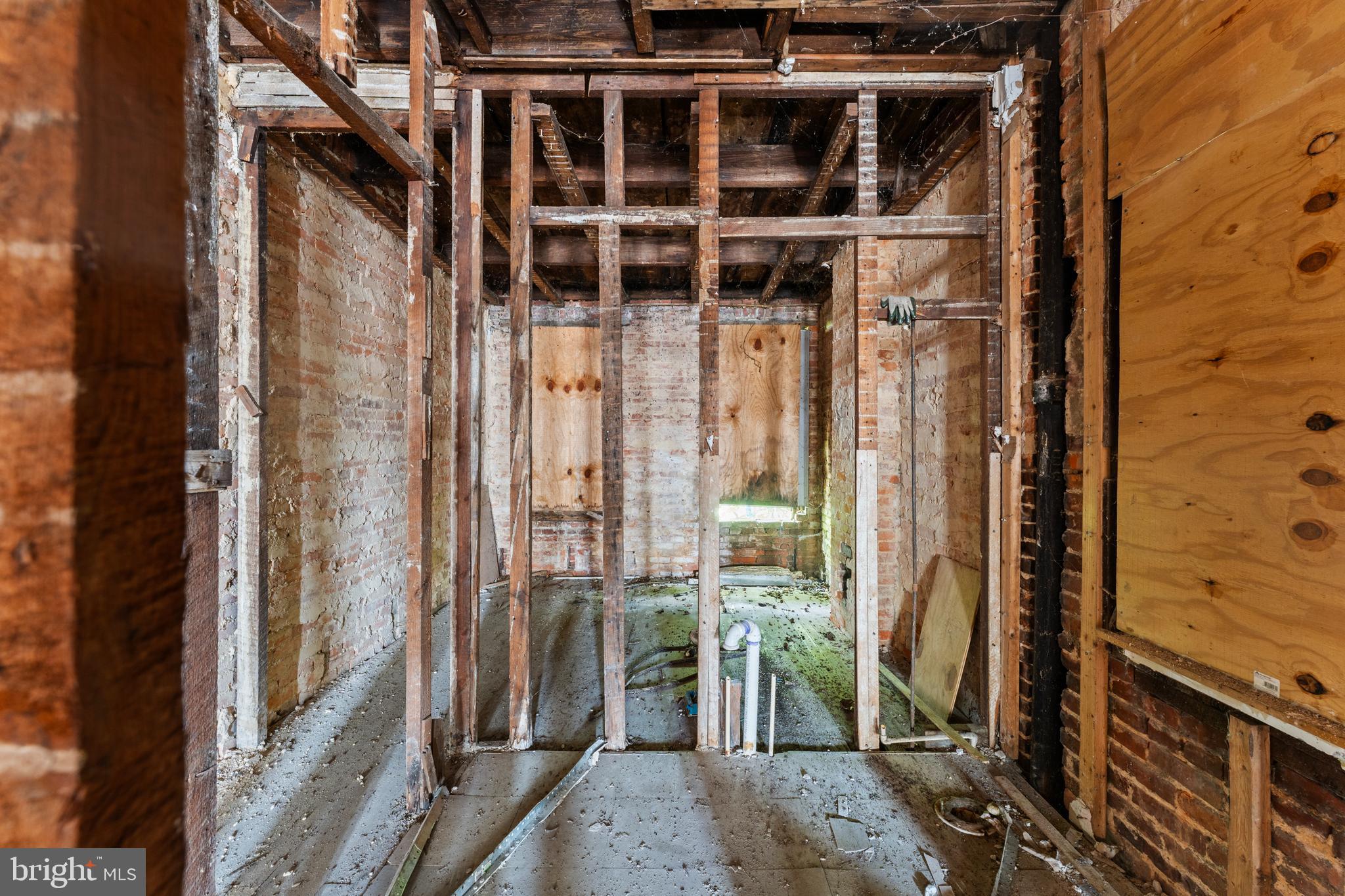 809 Appleton Street Baltimore, MD 21217 - Photo 14 of 16 a view of a balcony with wooden floor and a potted plant