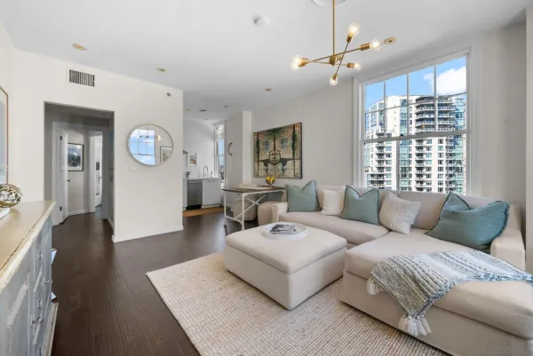a living room with furniture and a large window