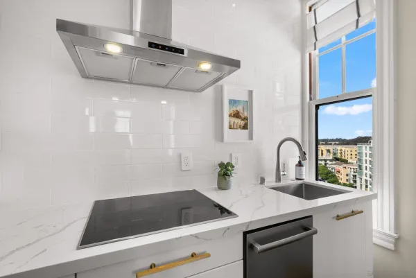 a kitchen with a sink and cabinets