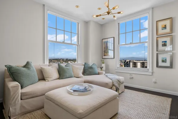 a living room with furniture and a large window