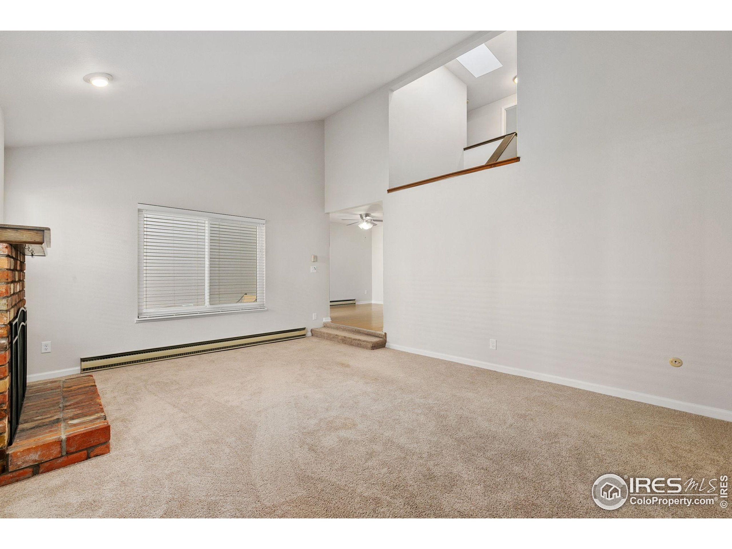 1741 Brookhaven Circle East, Unit D Fort Collins, CO 80525 - Photo 12 of 30 a view of an empty room with a window