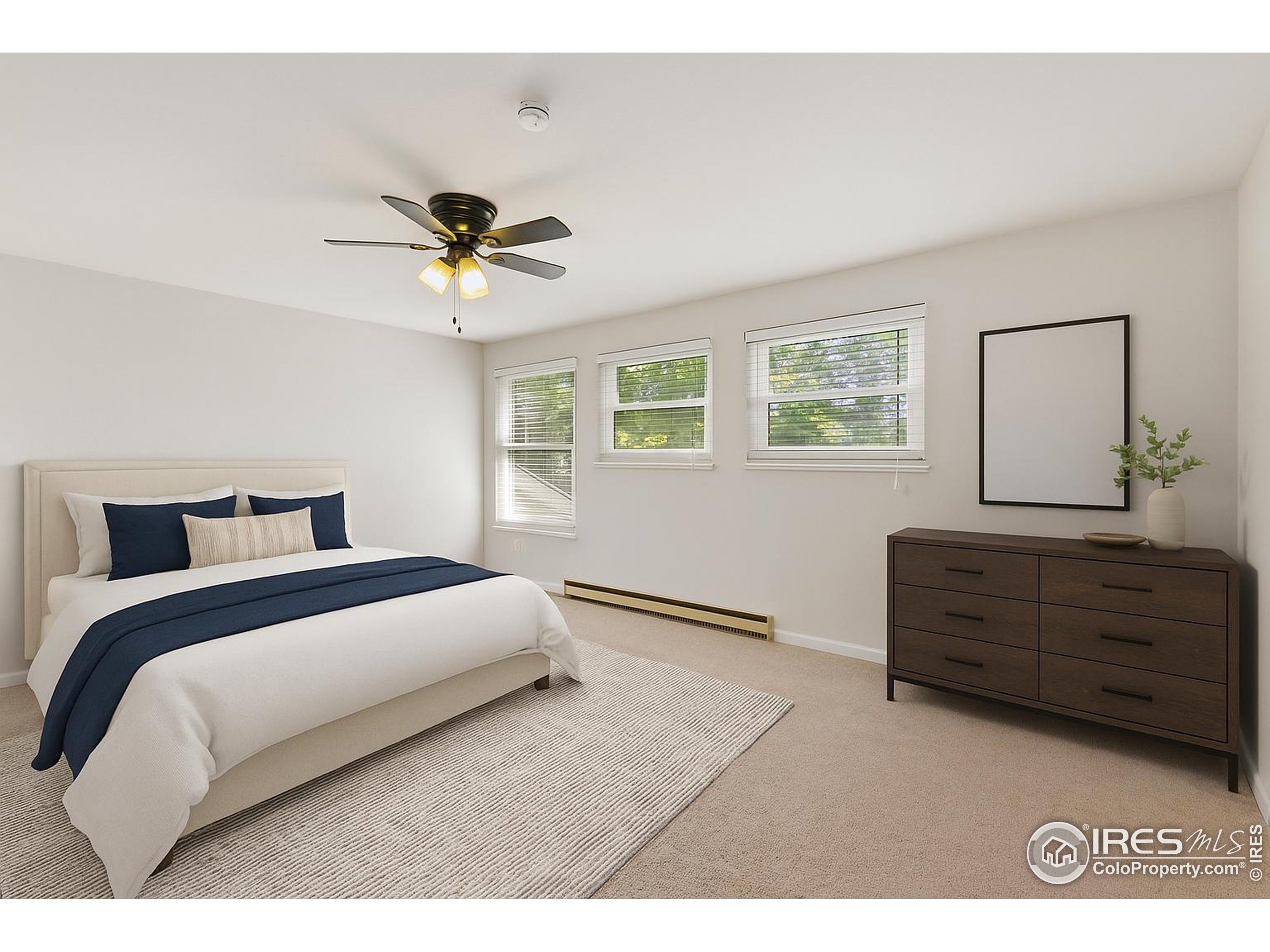 1741 Brookhaven Circle East, Unit D Fort Collins, CO 80525 - Photo 17 of 30 a bed room with a bed and a ceiling fan