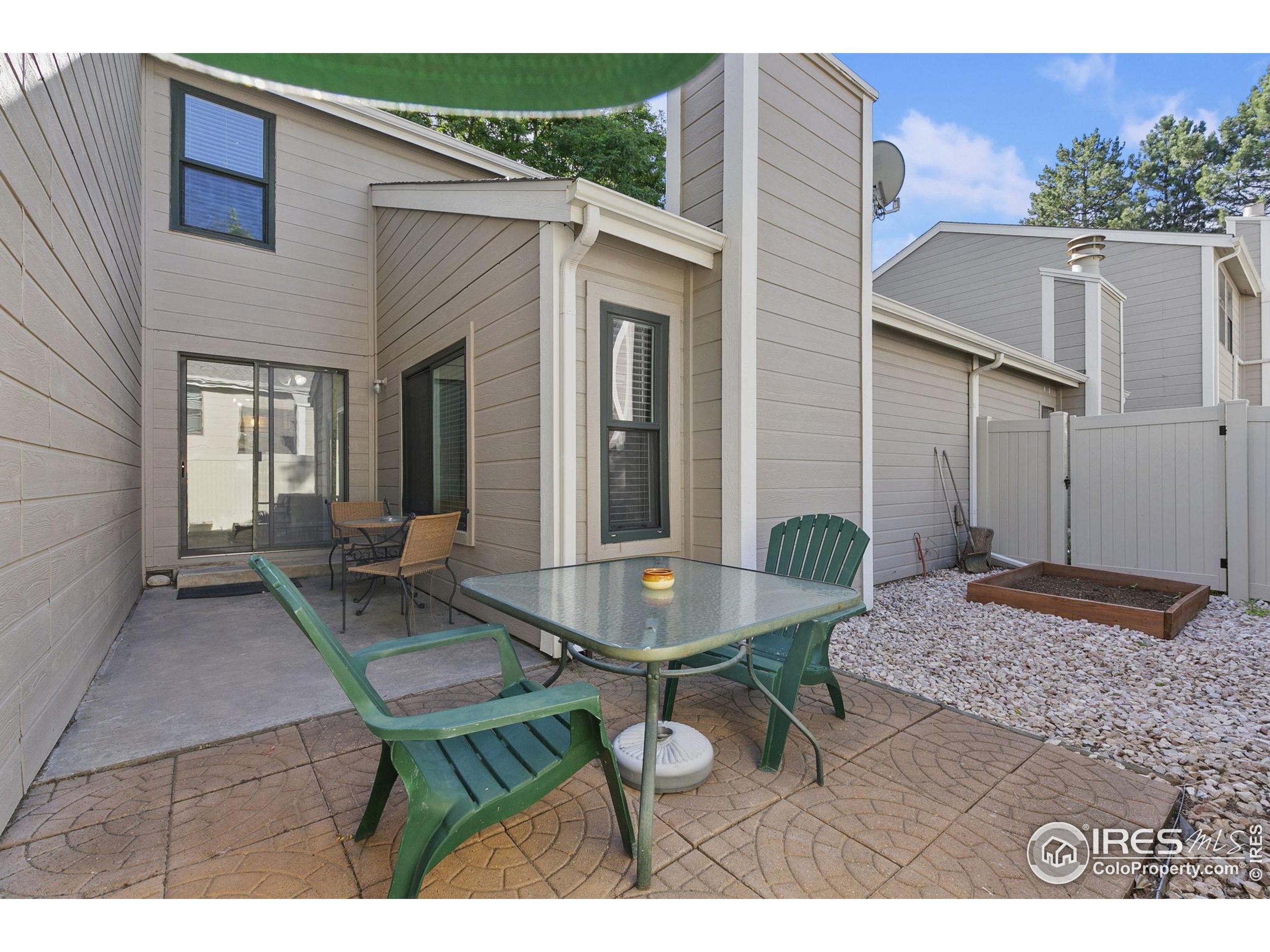 1741 Brookhaven Circle East, Unit D Fort Collins, CO 80525 - Photo 27 of 30 a view of a house with backyard and sitting area