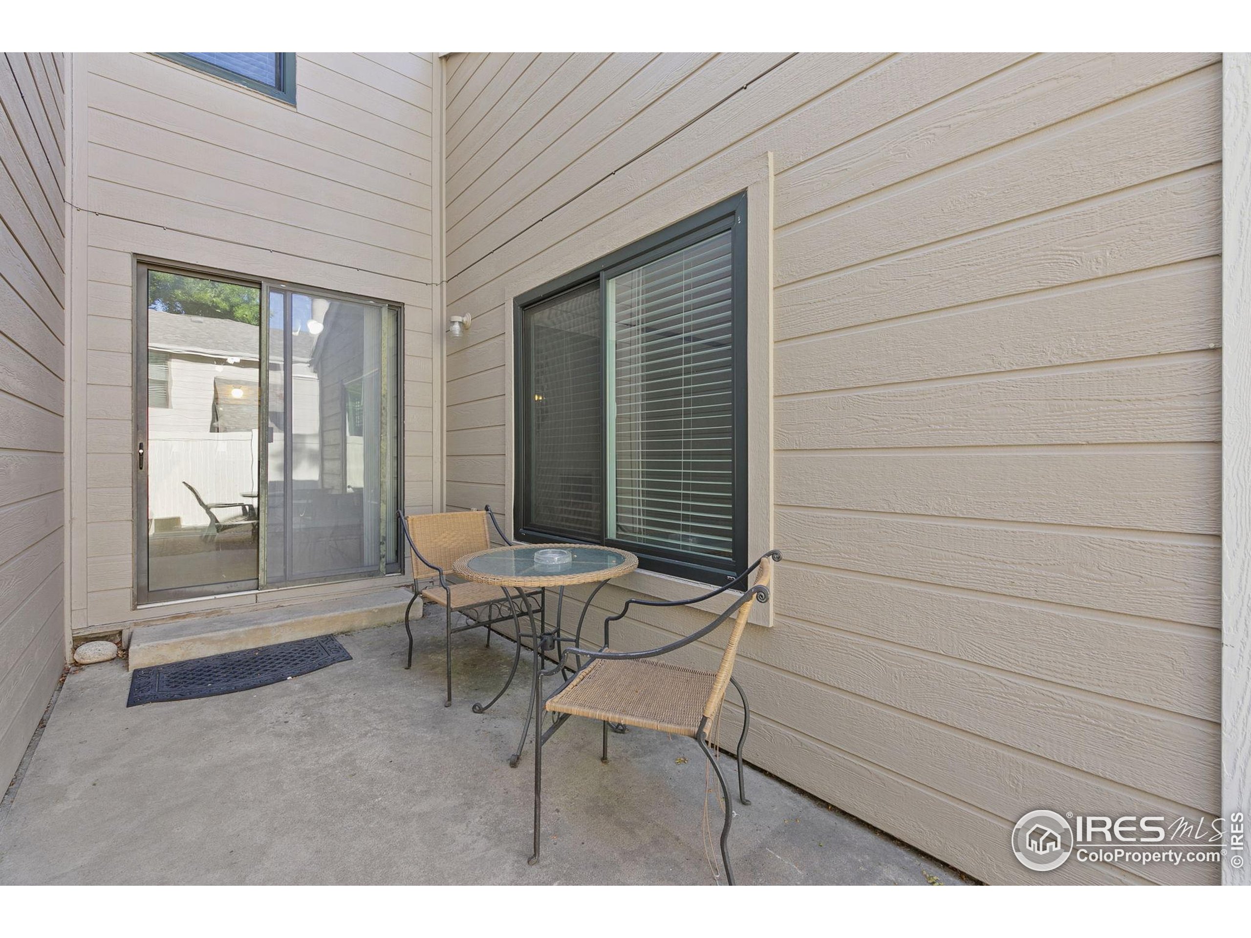 1741 Brookhaven Circle East, Unit D Fort Collins, CO 80525 - Photo 29 of 30 a balcony with table and chairs