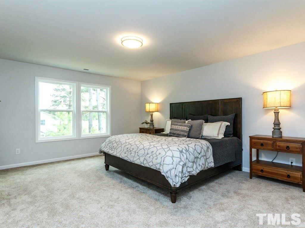 3340 Tracer Drive Graham, NC 27253 - Photo 12 of 23 a bedroom with a bed a lamp and a window