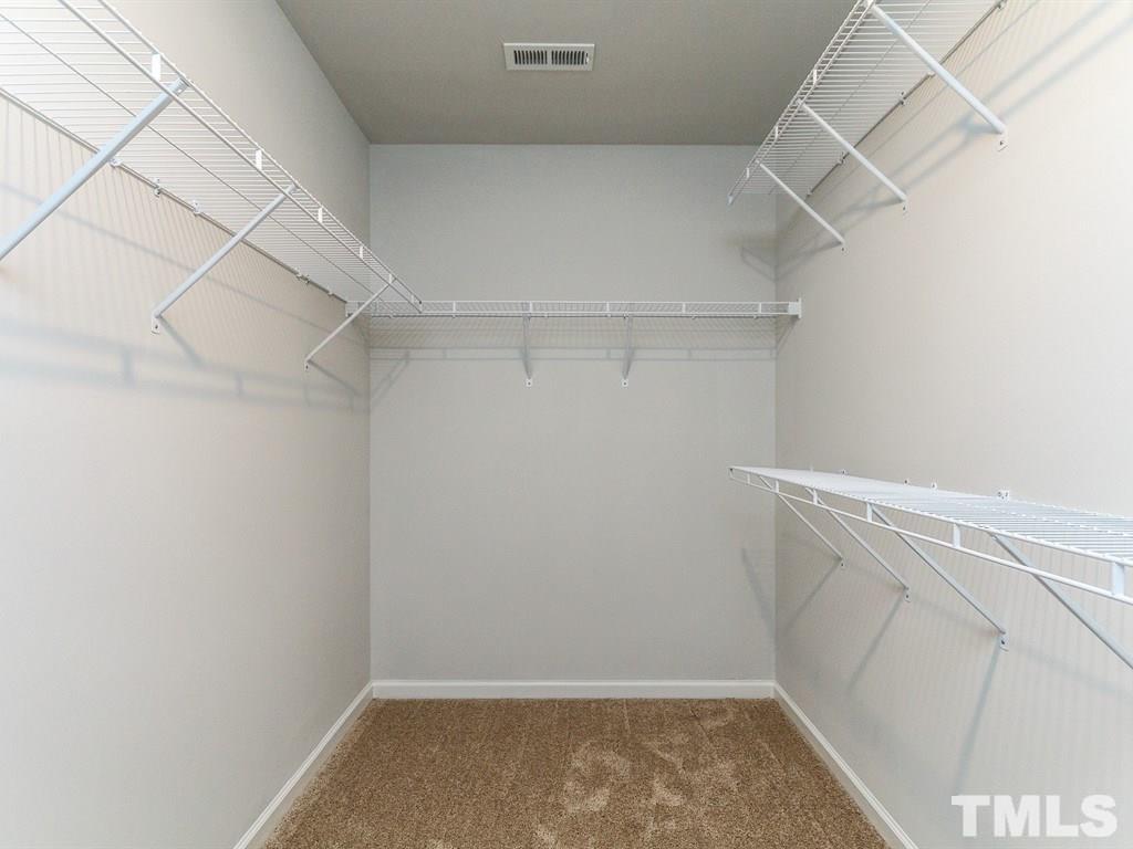 3340 Tracer Drive Graham, NC 27253 - Photo 14 of 23 a view of a room with racks on the wall